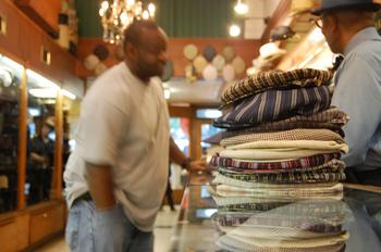 A stack of hats on the counter at J.J. Hat Center